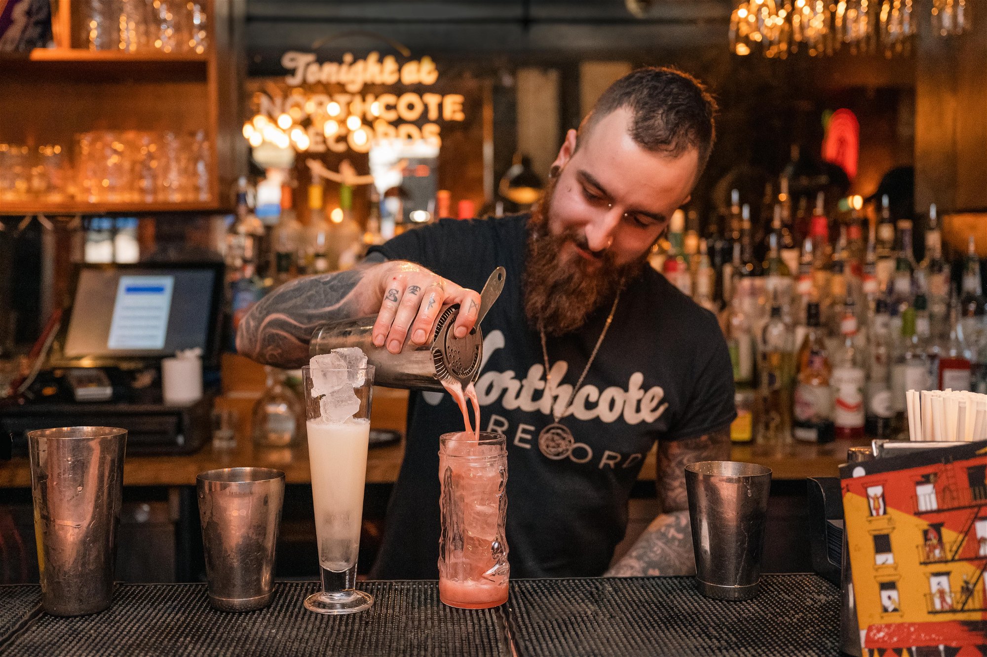 Cocktails being poured by bartender at Northcote Records in Battersea near Clapham Junction.